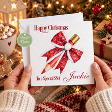 Load image into Gallery viewer, Personalised Christmas SNA or teacher card with red glitter pencil bow in cosy festive setting
