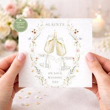 Load image into Gallery viewer, Handheld personalised Sláinte wedding card showing champagne glasses and ribbons
