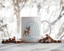 Load image into Gallery viewer, Baby Reindeer Blue Rainbow Christmas Mug
